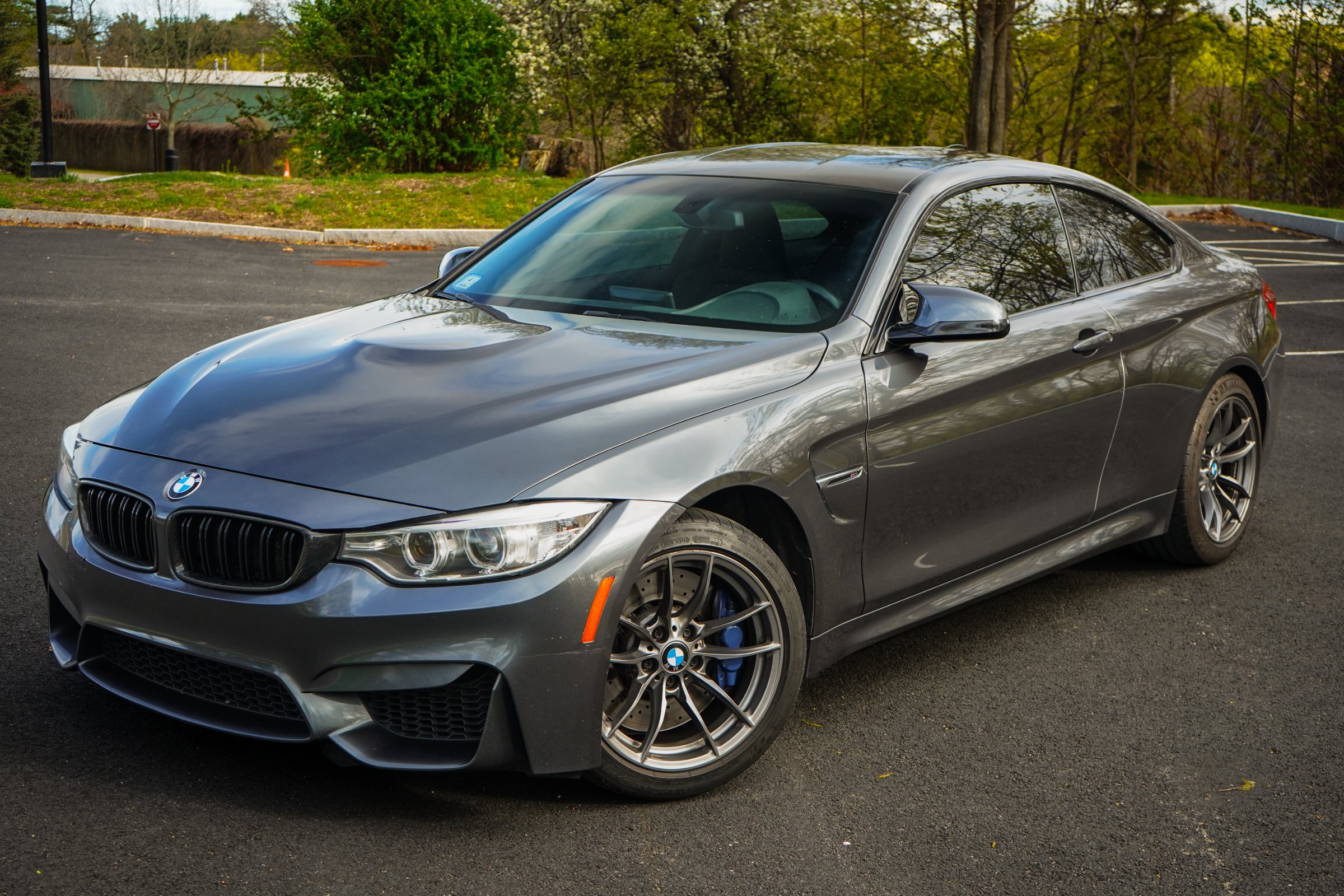 Mineral Grey BMW M4 F82 coupe, front three-quarter view